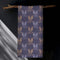 Set of four slate blue dining napkins featuring alternating gold and silver ravens in flight with botanical accents, sized 18x18 inches.